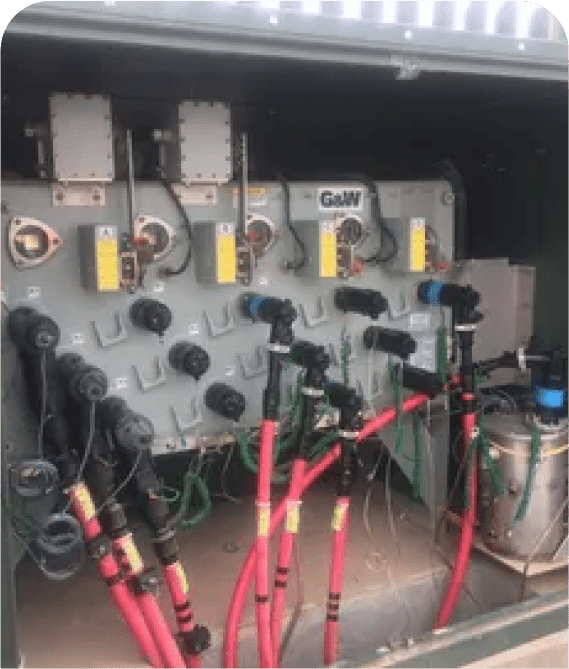 Electrical panel with multiple cables and connectors.