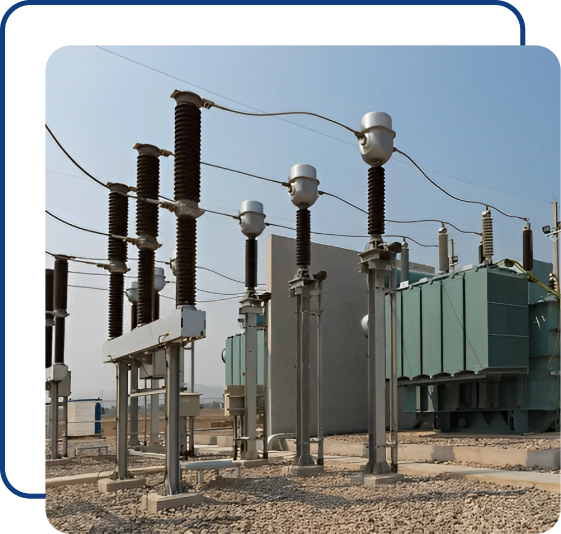 Electrical substation with transformers and insulators.