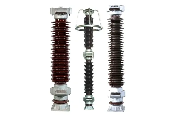 Three electrical insulators with ceramic bodies.