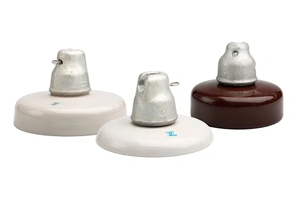 Three ceramic insulators with metal tops.