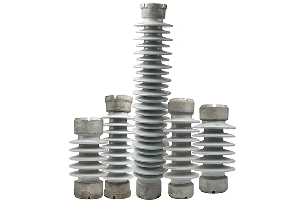 Five gray electrical insulators, different sizes.