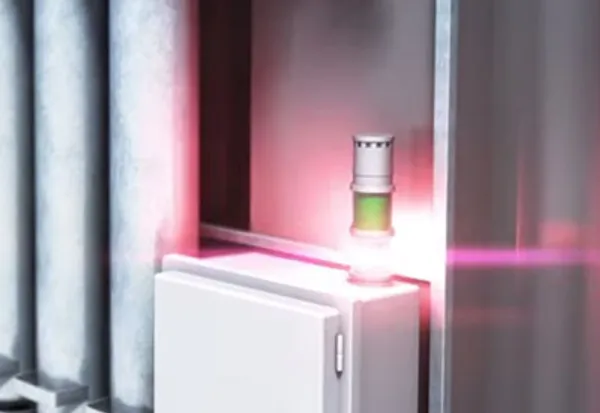 Industrial equipment with glowing red and green lights.