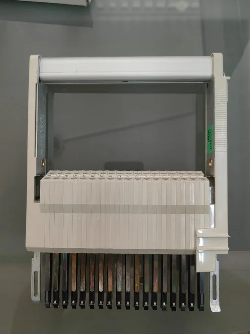 Telecommunications terminal block with plastic cover.