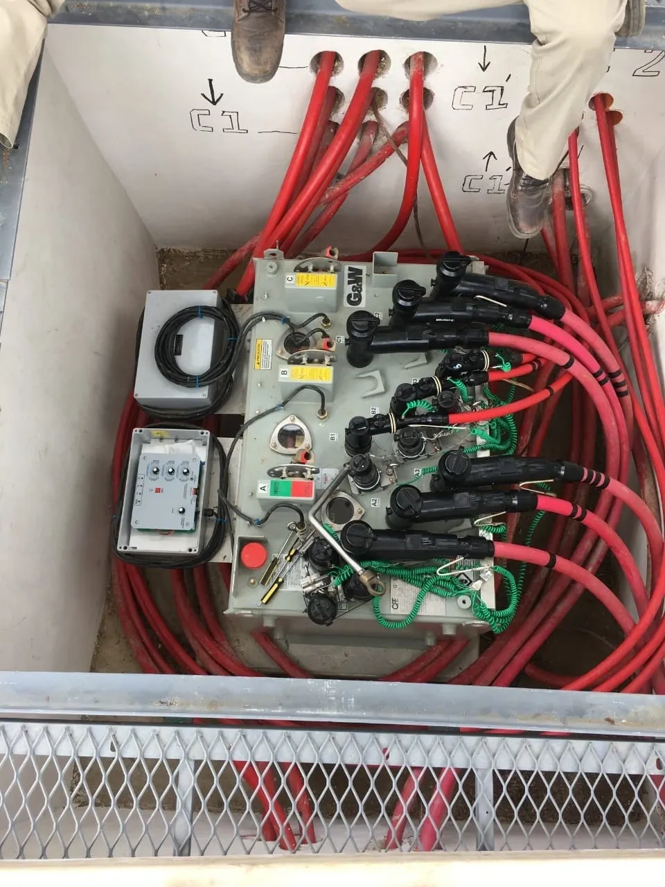Electrical equipment with red cables and controls.