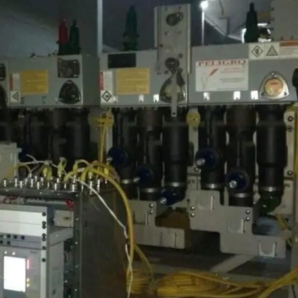 Industrial machinery with cables and control panel.