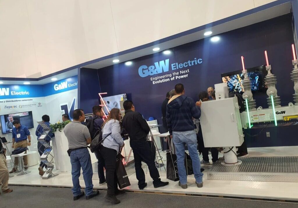 People visiting G&W Electric exhibition booth.