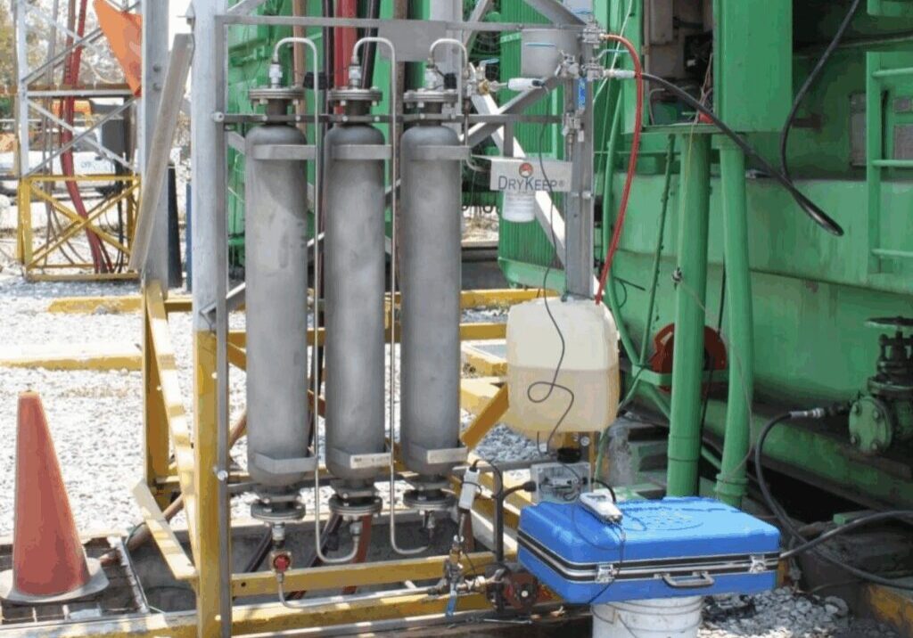 Industrial equipment with cylinders and control box.